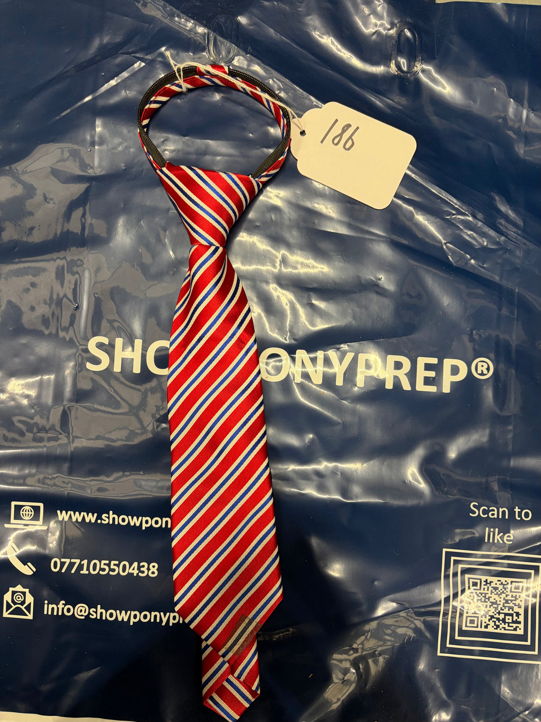 Lot 186 - Child’s Blue and Red Tie (Zip Broke)