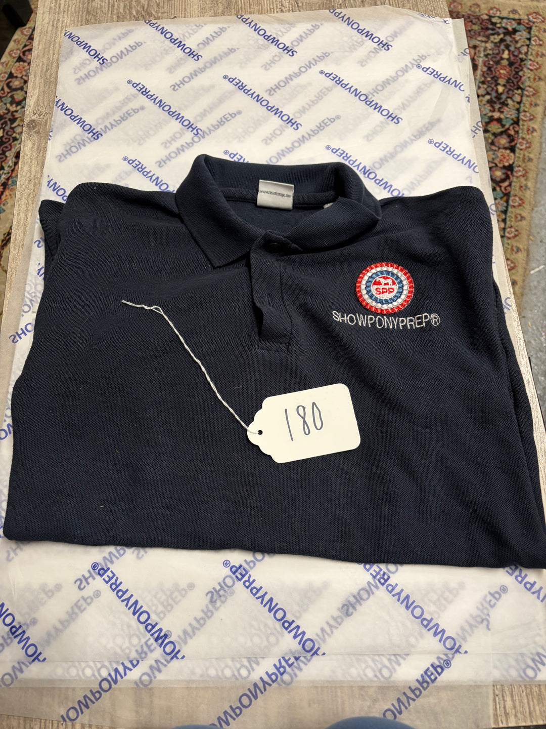 Lot 180 - Embroidered polo top child medium/large