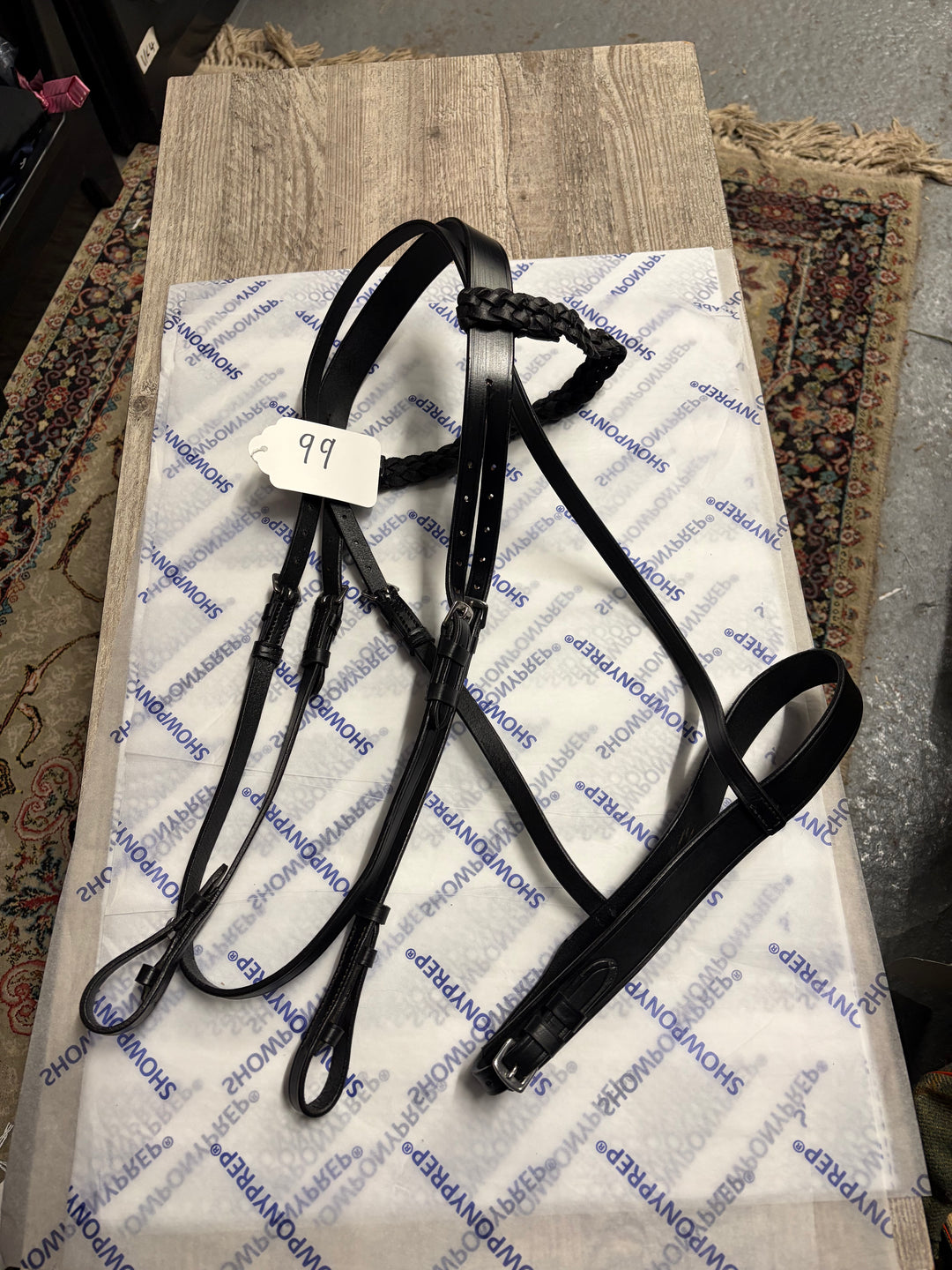 Lot 99- Black show bridle with flat noseband and fully braided browband